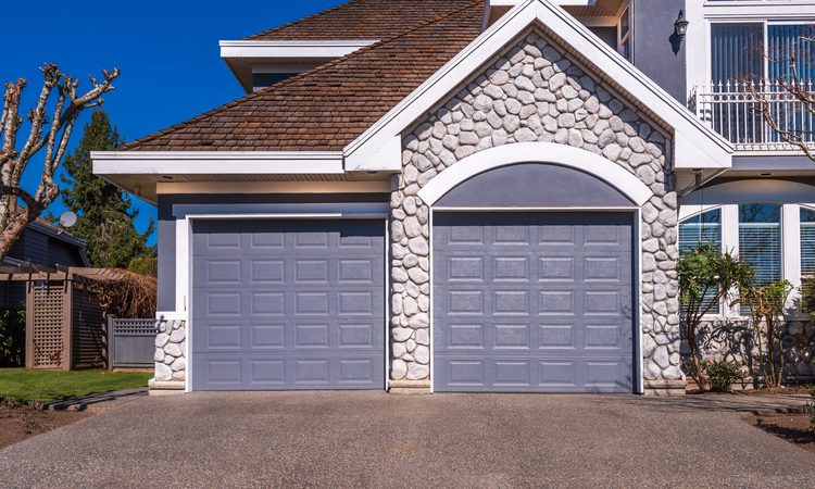 Garage door technician's truck stocked with springs and parts